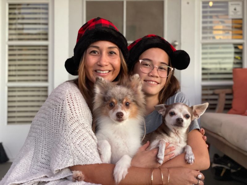 Holding Two Small Dogs